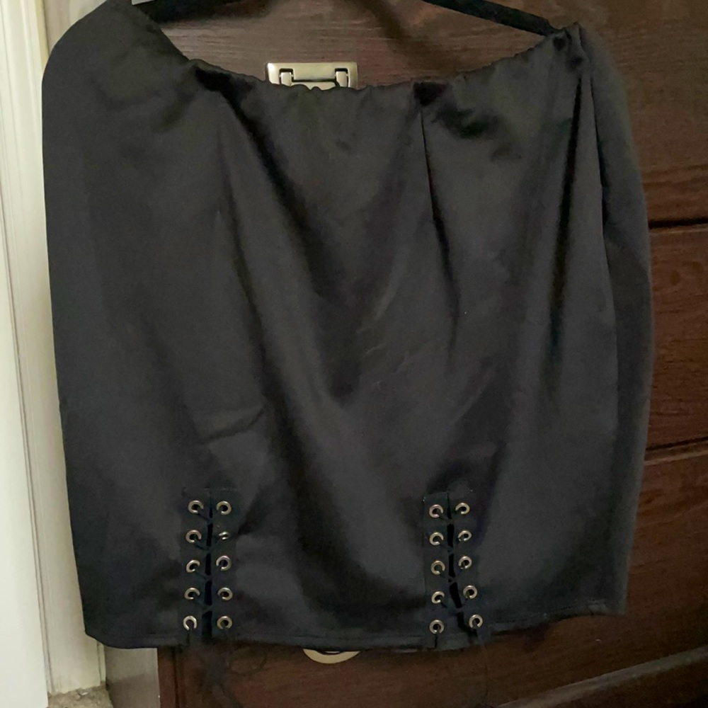 Black leather skirt with metal details